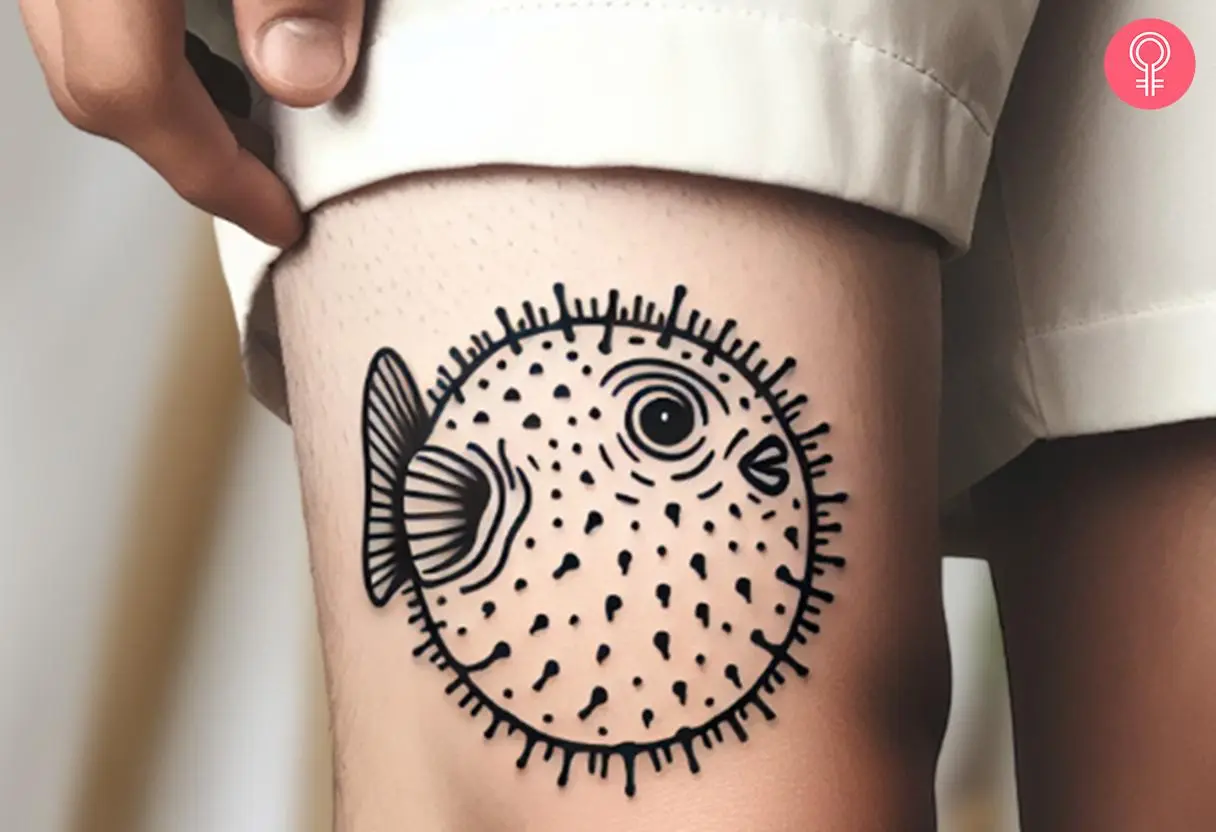 A minimalist puffer fish on a man’s knee