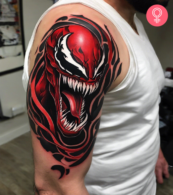 A realistic tattoo of Carnage on a man’s upper arm