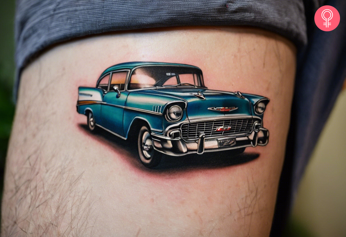 A red 55 Chevy tattoo on the back of the arm