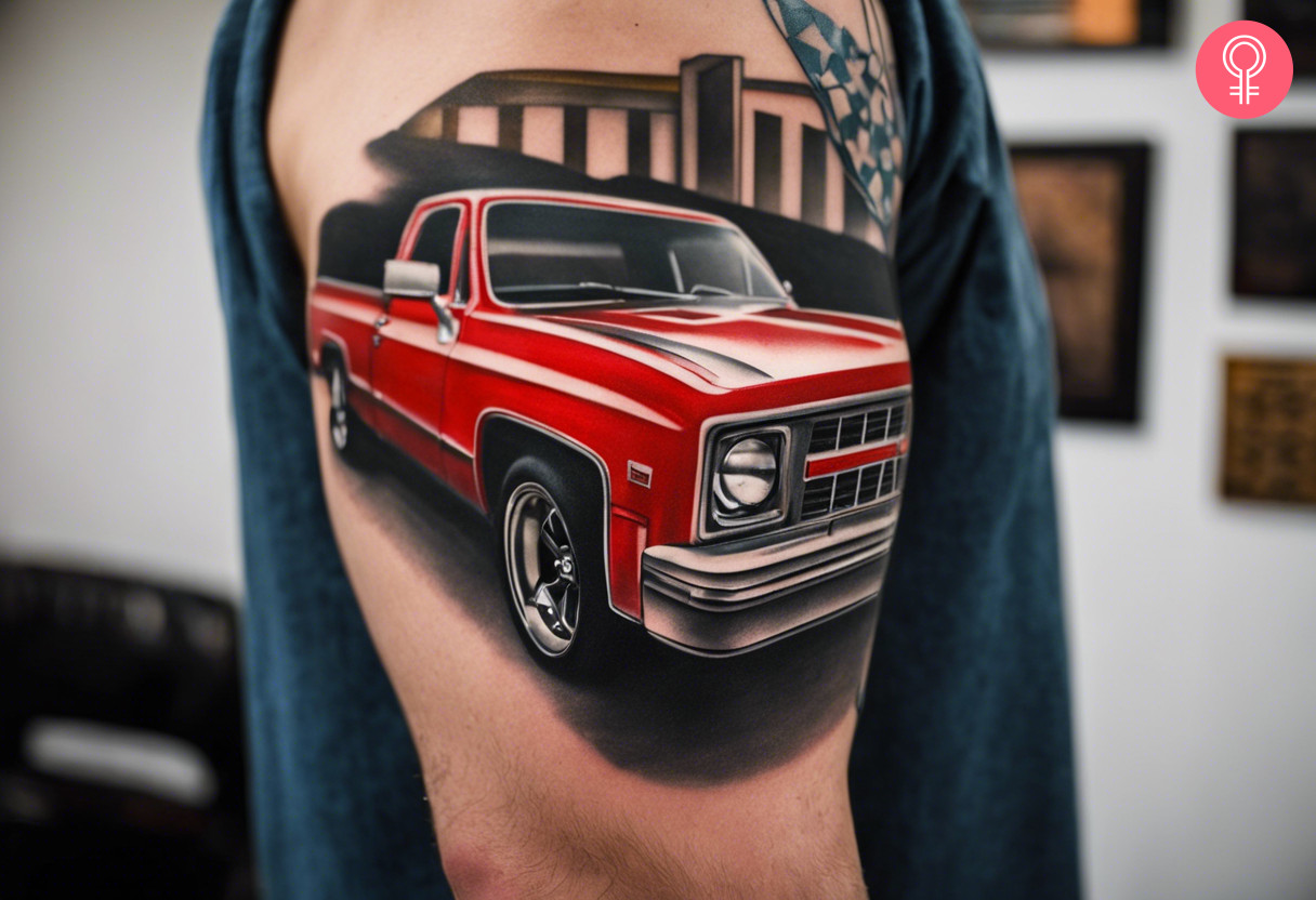 A red square body Chevy pickup tattoo on the upper arm