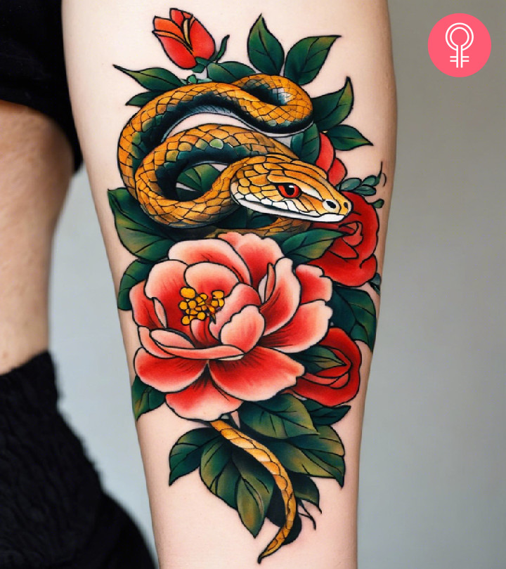 A serpent tattoo on the forearm with flowers