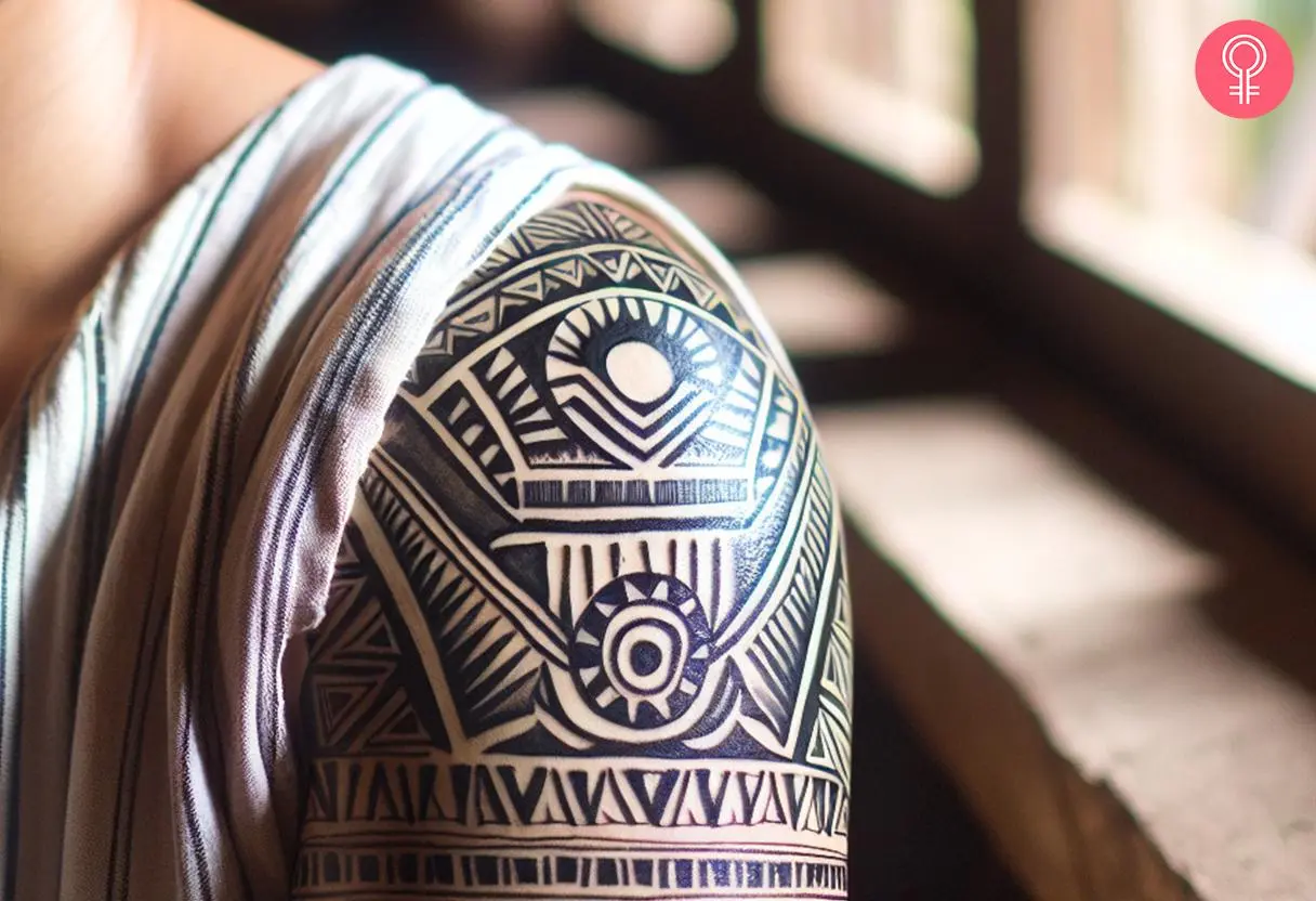 A shoulder cuff Filipino sun tattoo with geometric designs