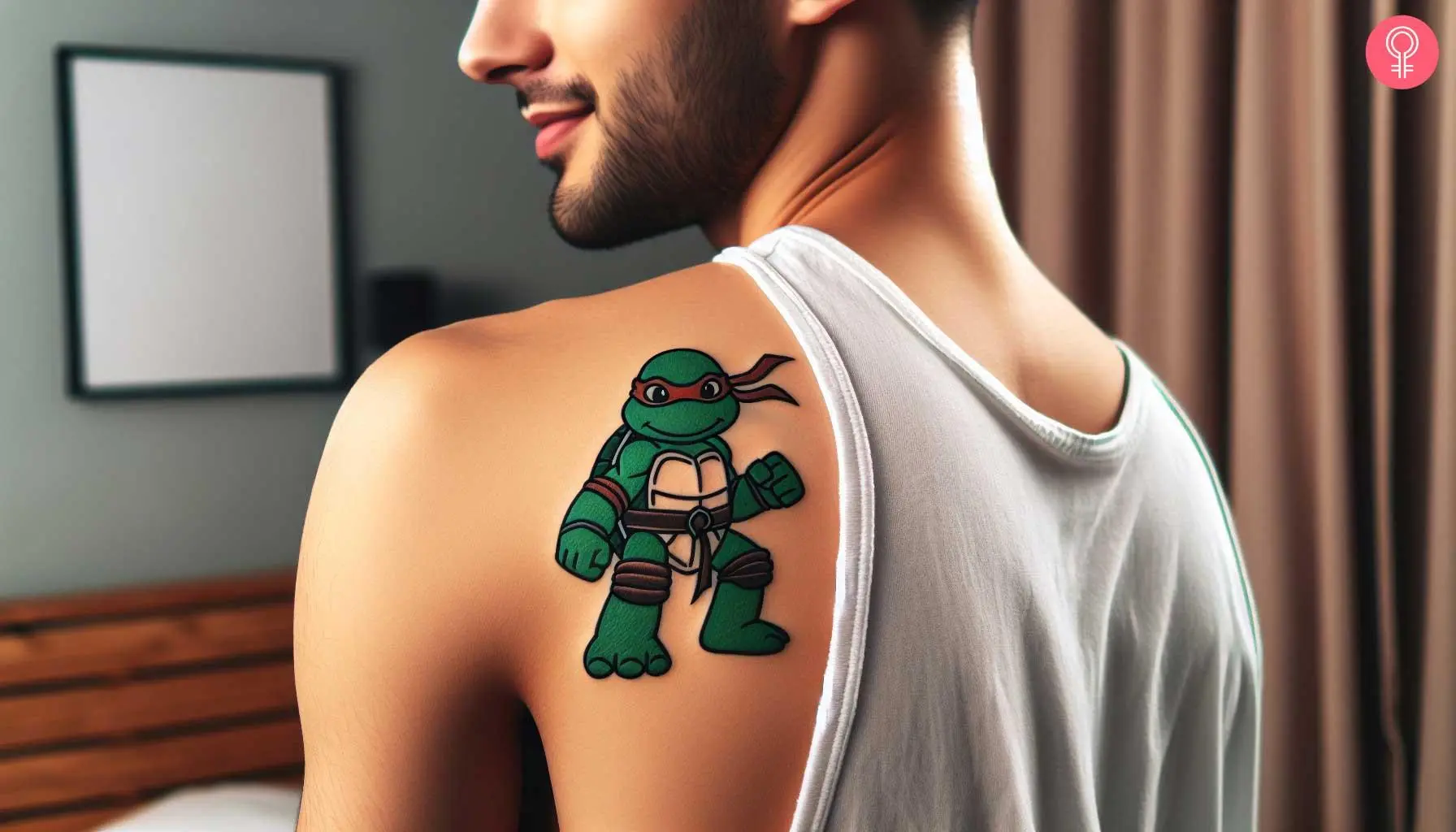 A small, baby ninja turtle tattoo on a man’s shoulder