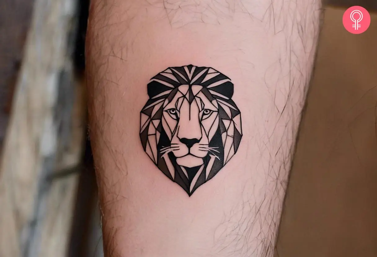 A small geometric lion tattoo on the forearm