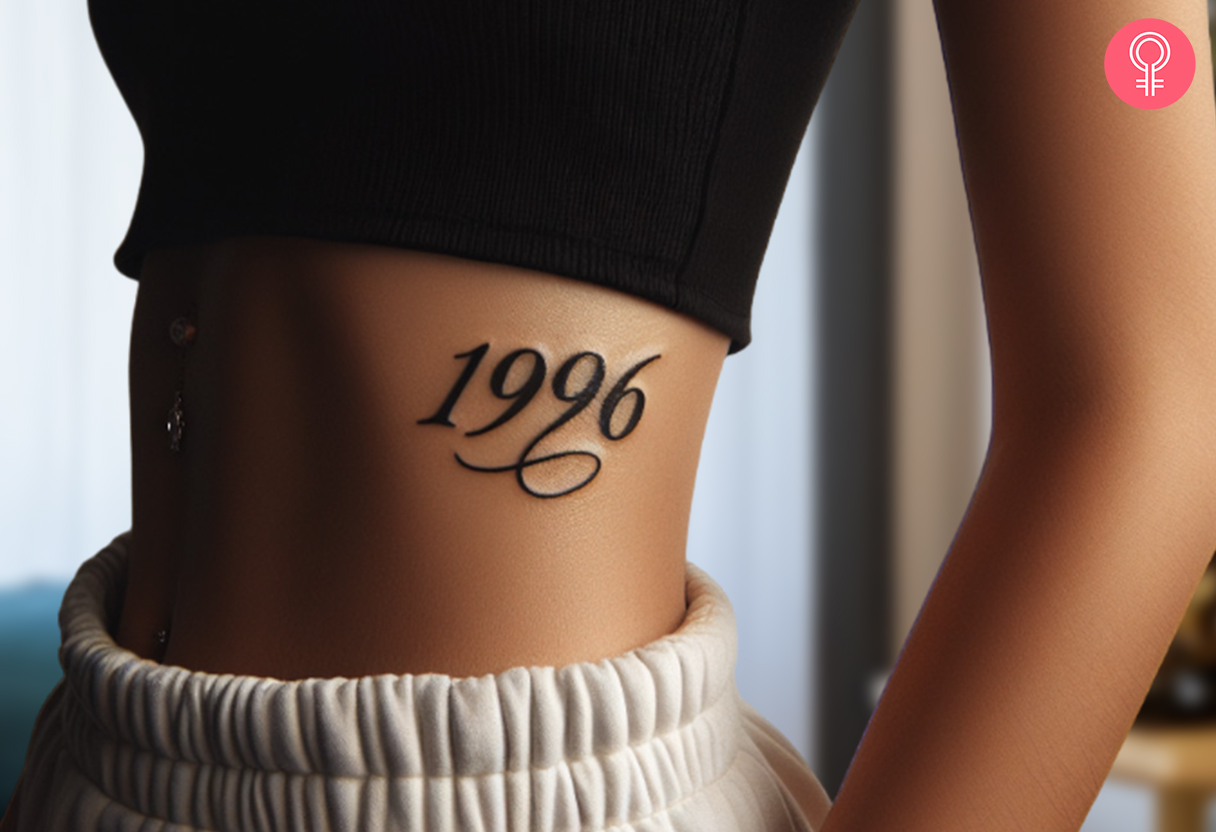 A stylish 1996 tattoo inked on the side of the stomach