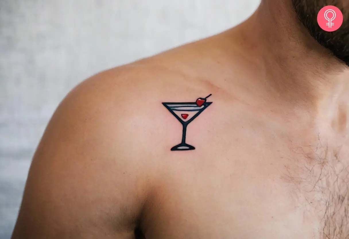 A traditional colorful marini glass shoulder tattoo on the upper thigh.