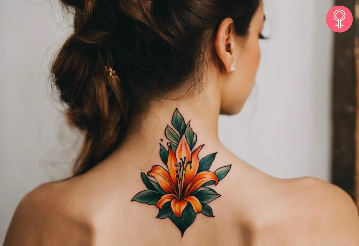 A traditional foliage tattoo with a tiger lily on the back of the neck