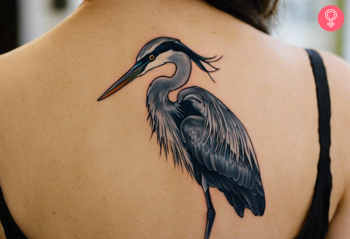 A traditional heron tattoo on a woman’s back