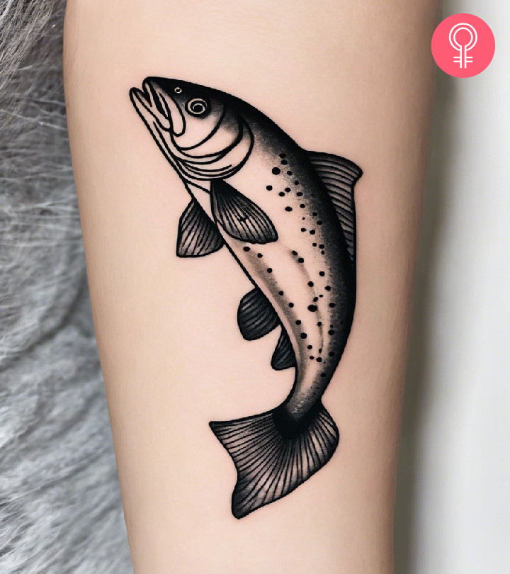 A traditional outline trout inked on a woman’s forearm.