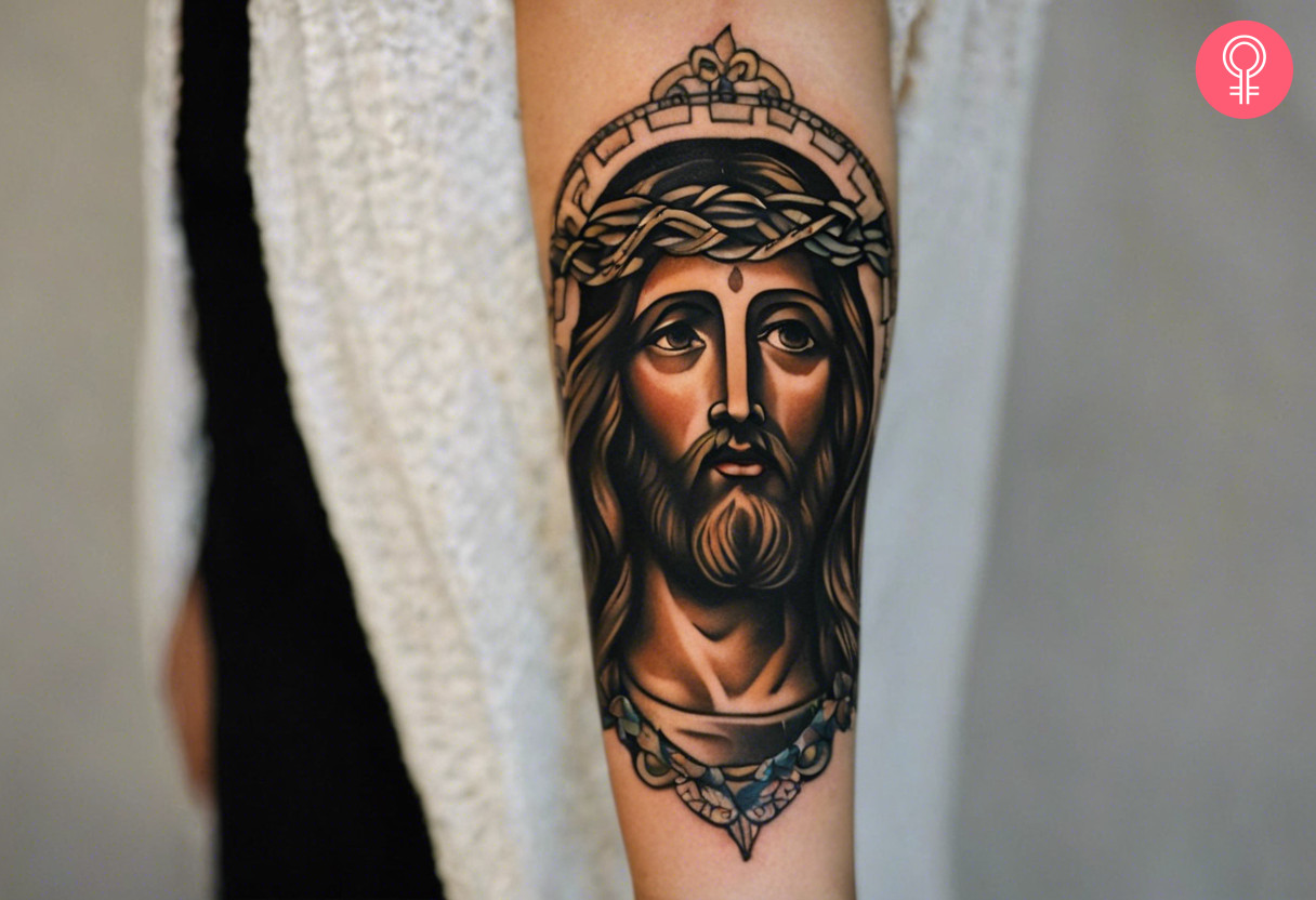 A traditional tattoo of a Jesus inked on the forearm