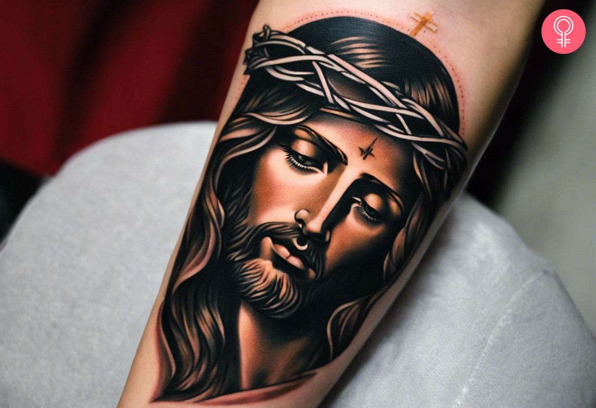 A traditional tattoo of a Jesus inked on the forearm