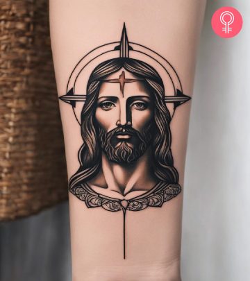 A traditional tattoo of a Jesus inked on the forearm