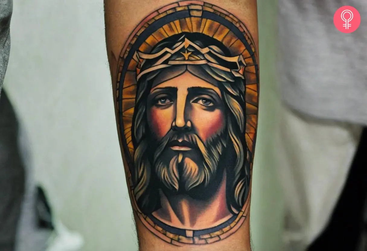 A traditional tattoo of a Jesus inked on the forearm