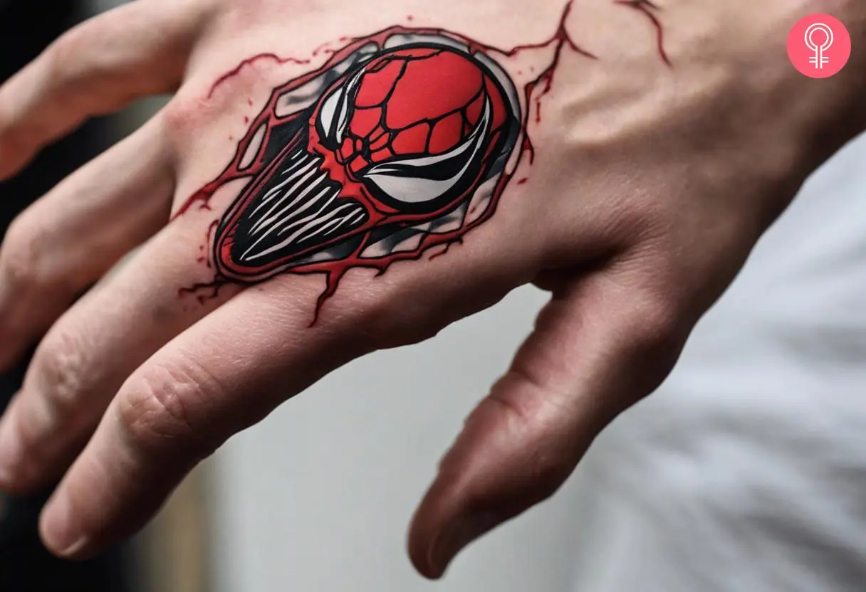 A very small and simple Carnage tattoo on the back of the hand