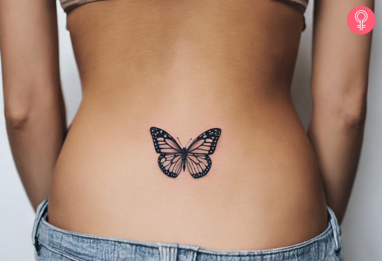 A woman wearing a butterfly tattoo on her lower back