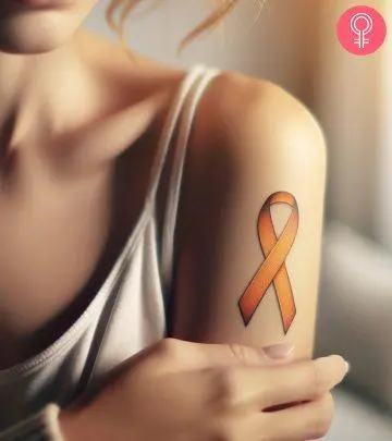 A woman wearing an MS ribbon on her arm