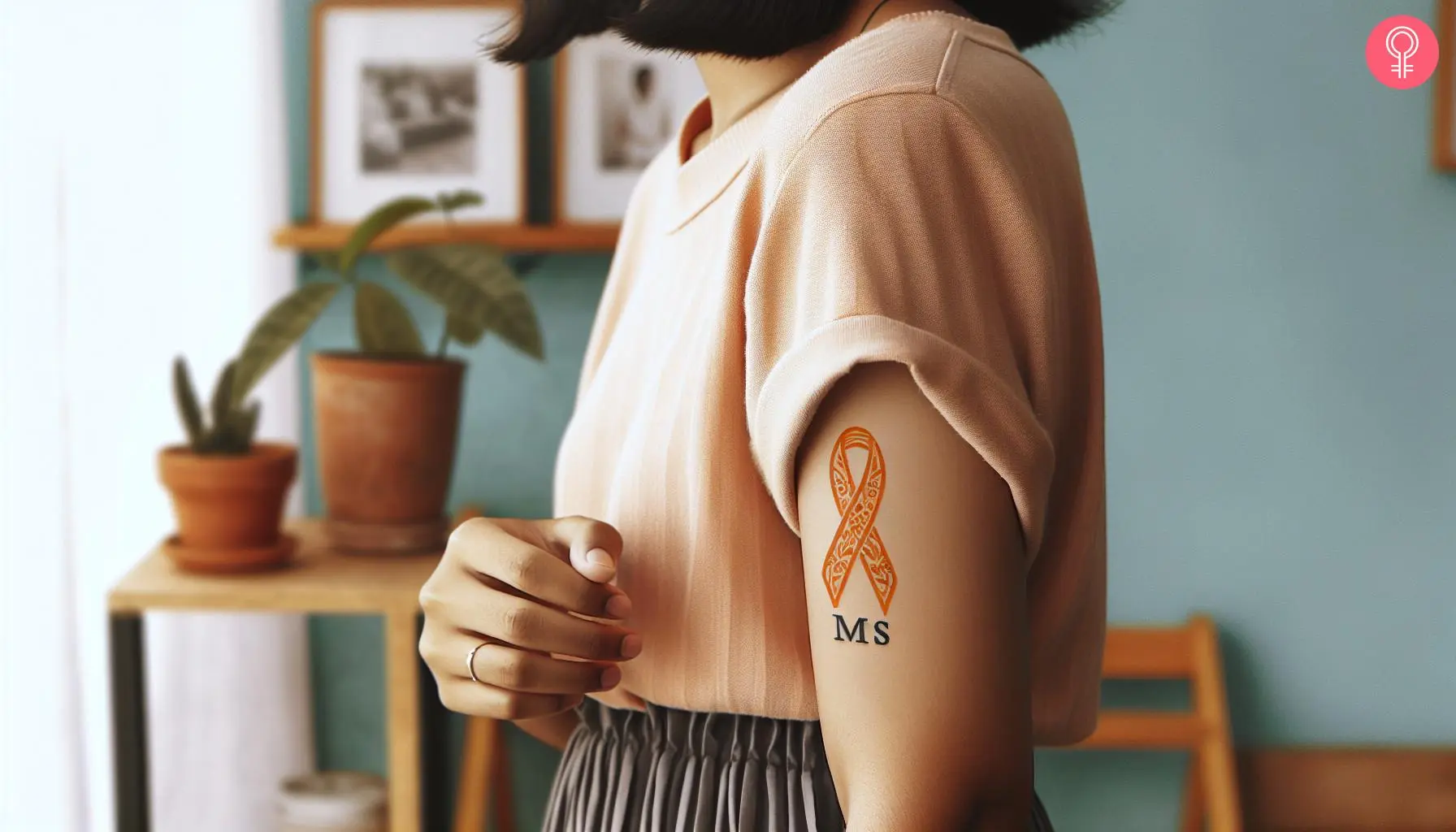 A woman wearing an ‘alphabet MS’ tattoo on the upper hand