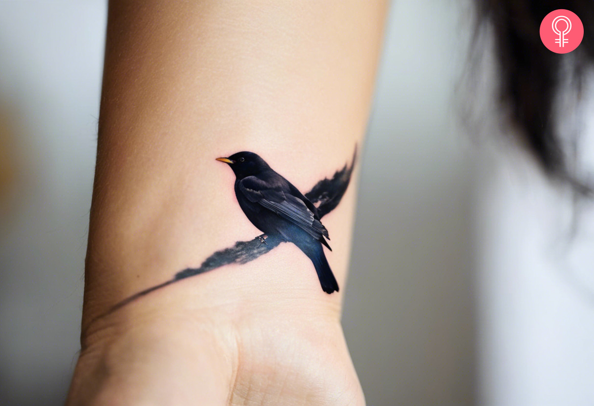 A woman with a blackbird tattoo on her wrist