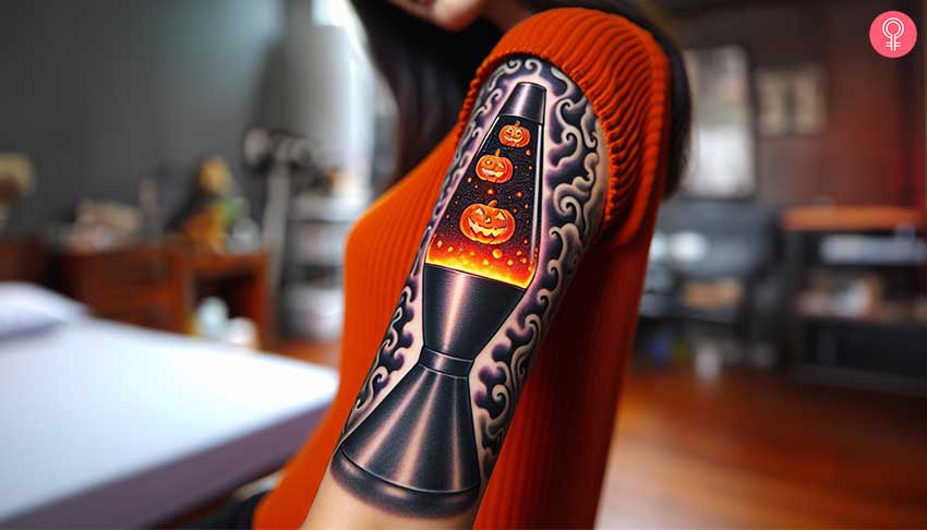 A woman with a colorful Halloween-style lava lamp tattoo on her upper arm