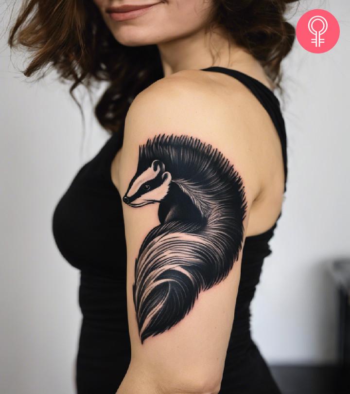 A woman with a skunk tattoo on her arm