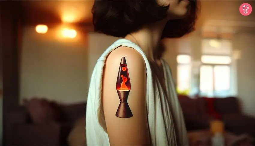 A woman with a small colorful lava lamp tattoo on her upper arm