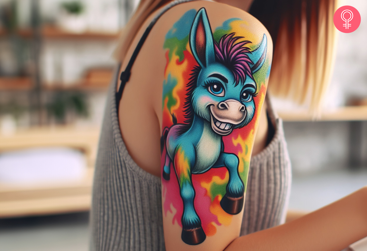 A woman with a vibrant cartoon donkey tattoo on her upper arm