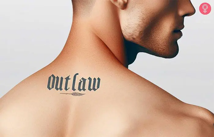 An outlaw text tattoo on the upper back