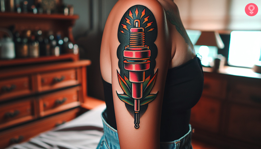 A woman with a colored American-traditional style spark plug tattoo on her upper arm