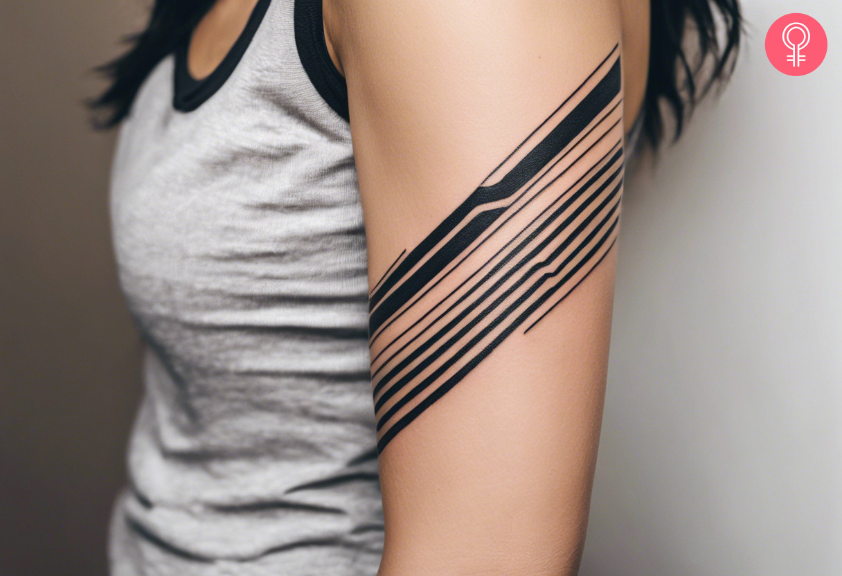 A stripe tattoo on the arm of a woman