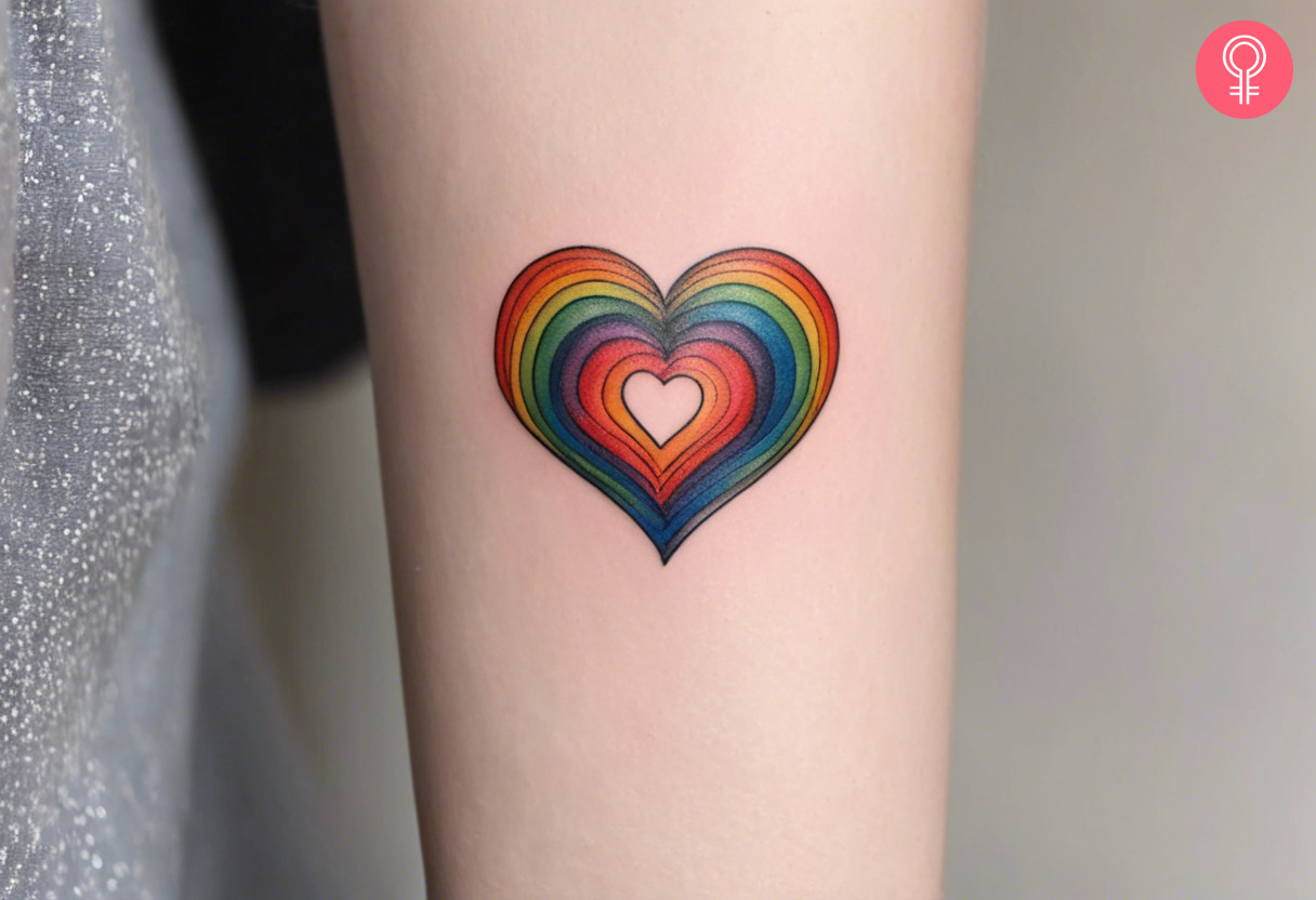 Rainbow heart tattoo on the forearm