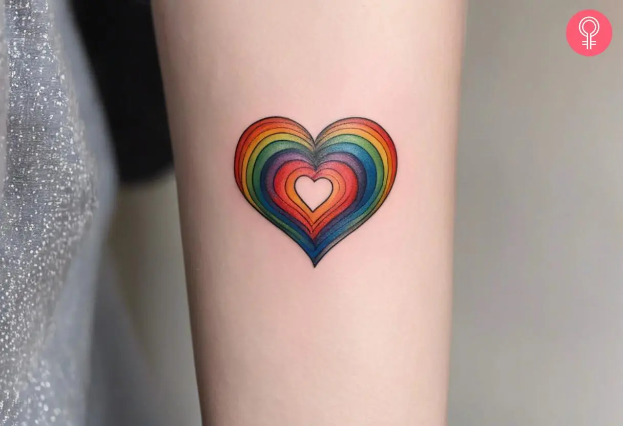 Rainbow heart tattoo on the forearm