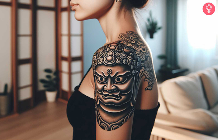 A black and gray Fudo Myoo tattoo on the shoulder