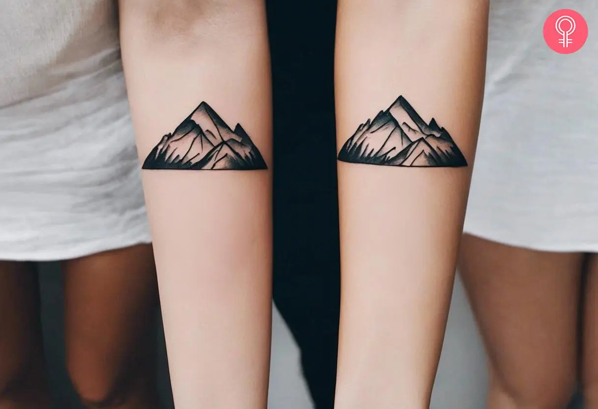 Matching mountain tattoo on the forearm