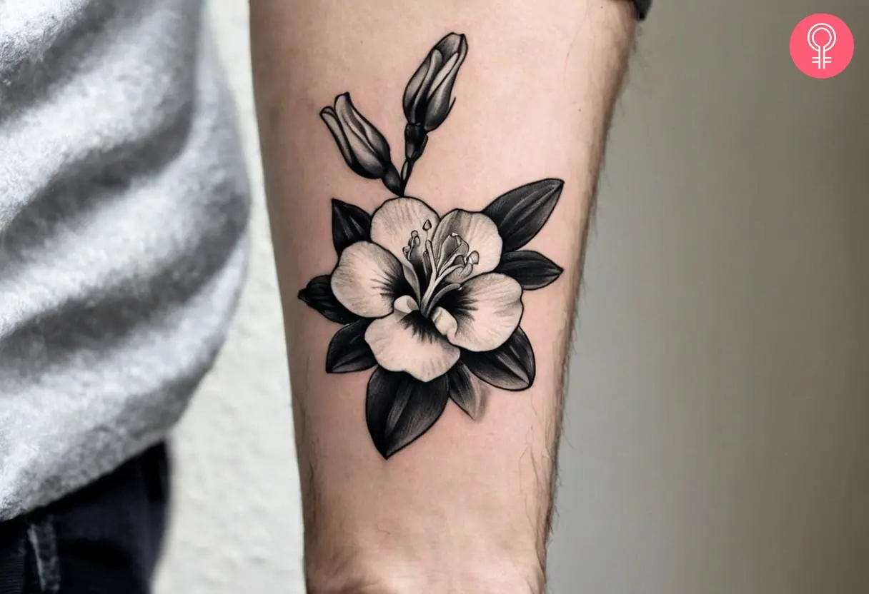 A black-and-gray freesia tattoo on the arm