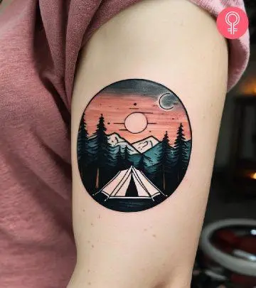 Camping tattoo on the upper arm