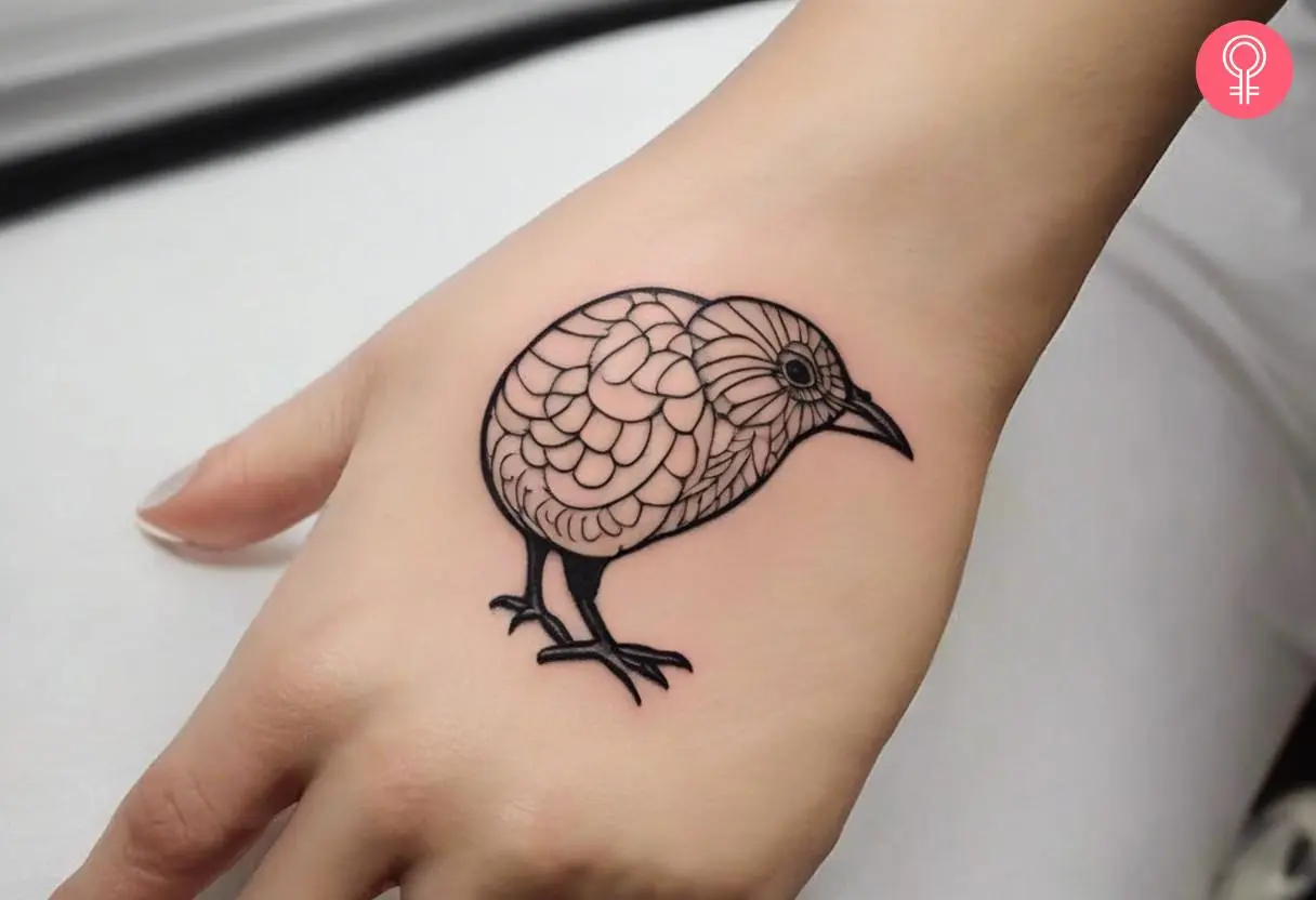 Woman with cartoon kiwi bird tattoo on her hand