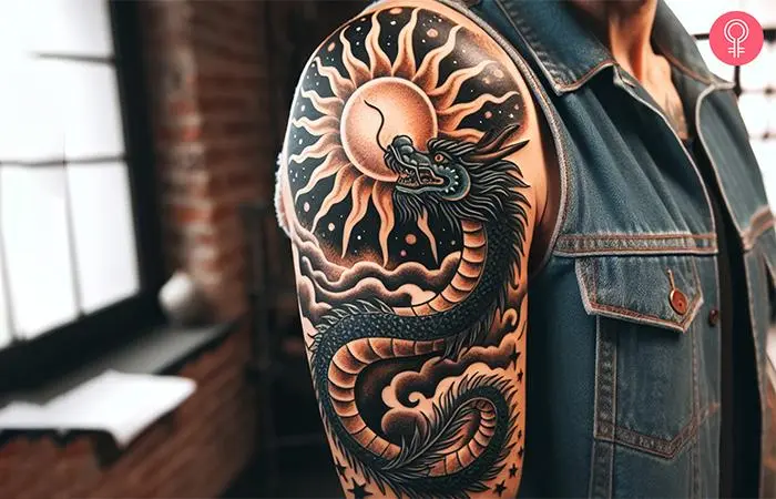 A man with a Chinese dragon and rising sun tattoo on the upper arm.