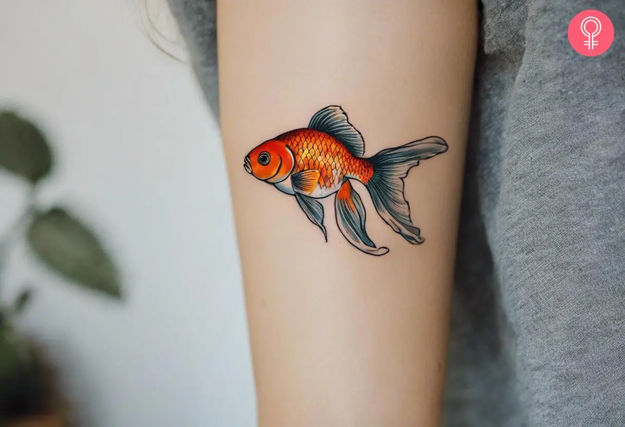 A Chinese goldfish tattoo on a woman’s arm