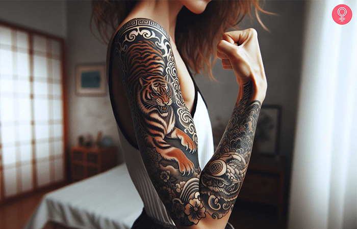 A woman with a colored Chinese zodiac tiger tattoo on her full arm