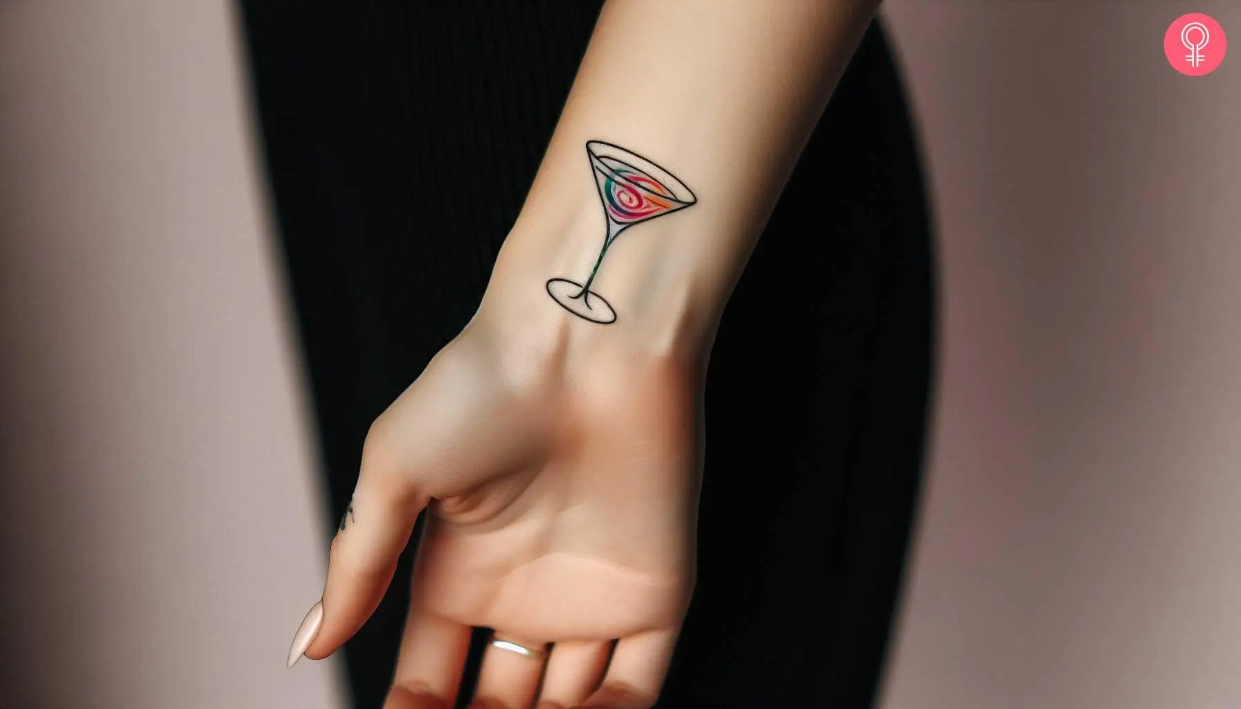 A wrist tattoo of a cocktail