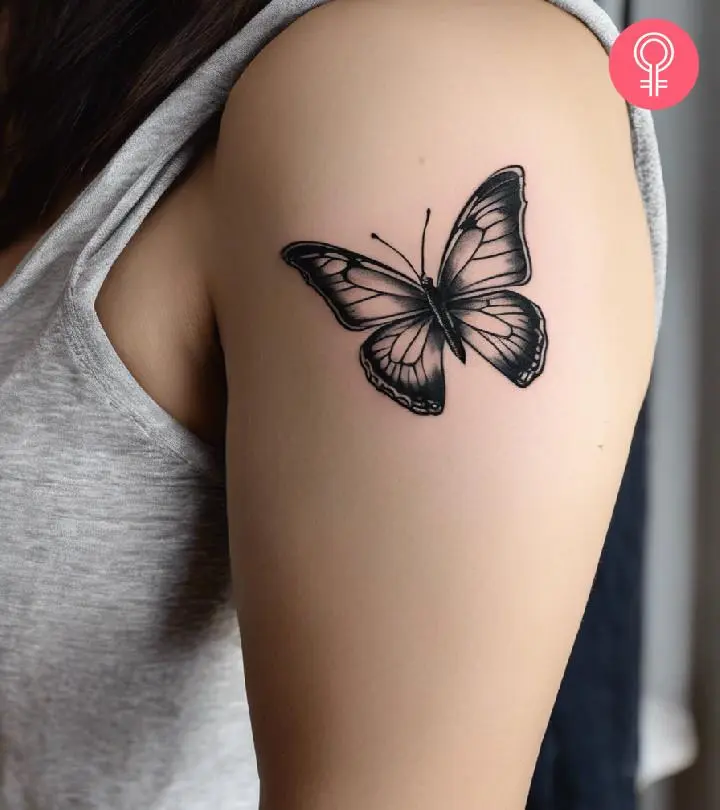 A woman with a buttery sketch tattoo