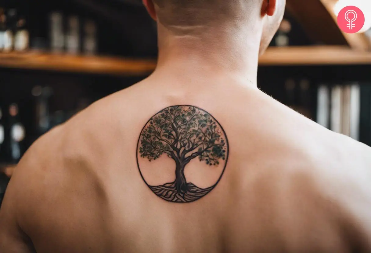 A man with a small Tree of Life tattoo on his back