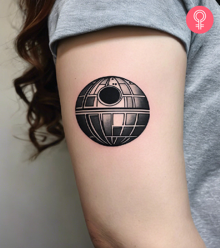 Death star tattoo on the upper arm