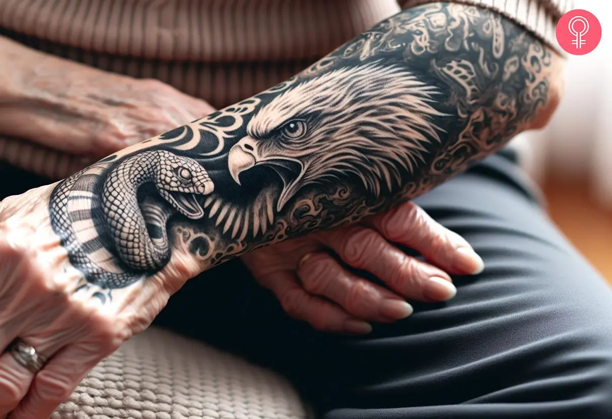 A woman with an eagle and snake tattoo on her forearm