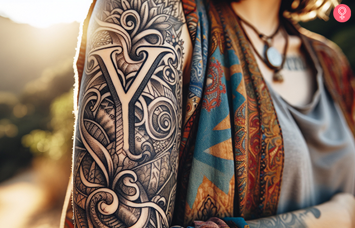 A woman with an elaborate upper arm Y tattoo