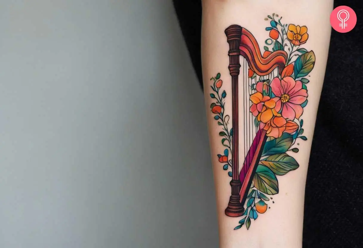 Feminine harp tattoo on the arm