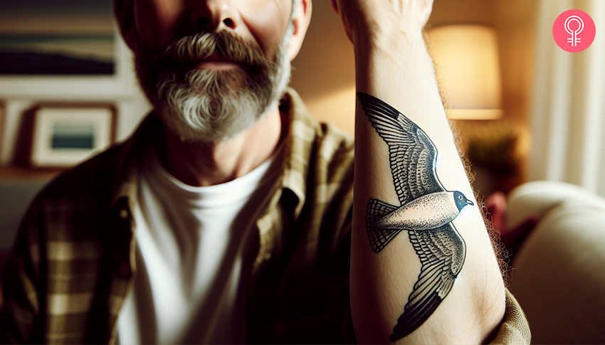 Flying seagull tattoo on the forearm