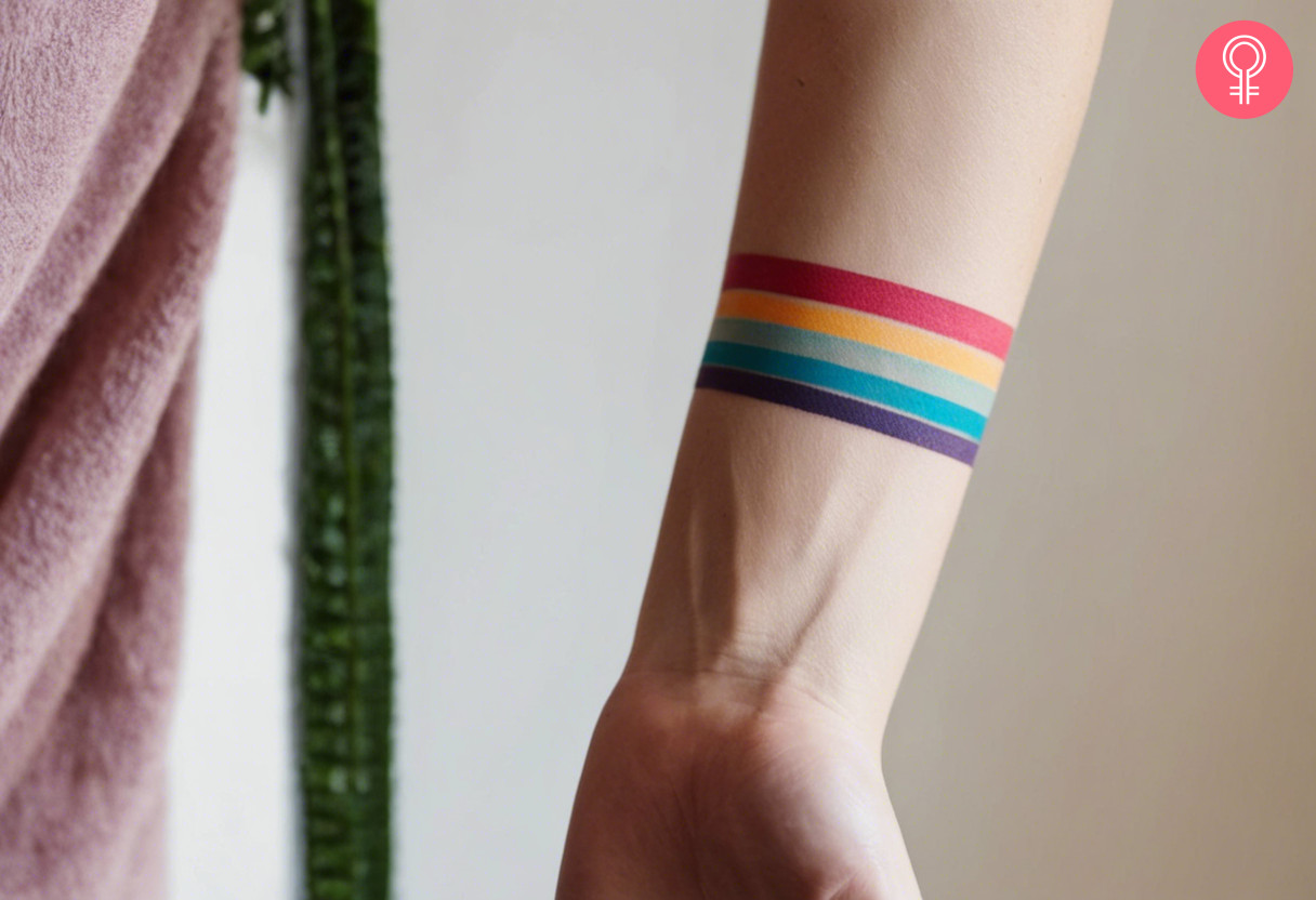 A colorful forearm stripe tattoo