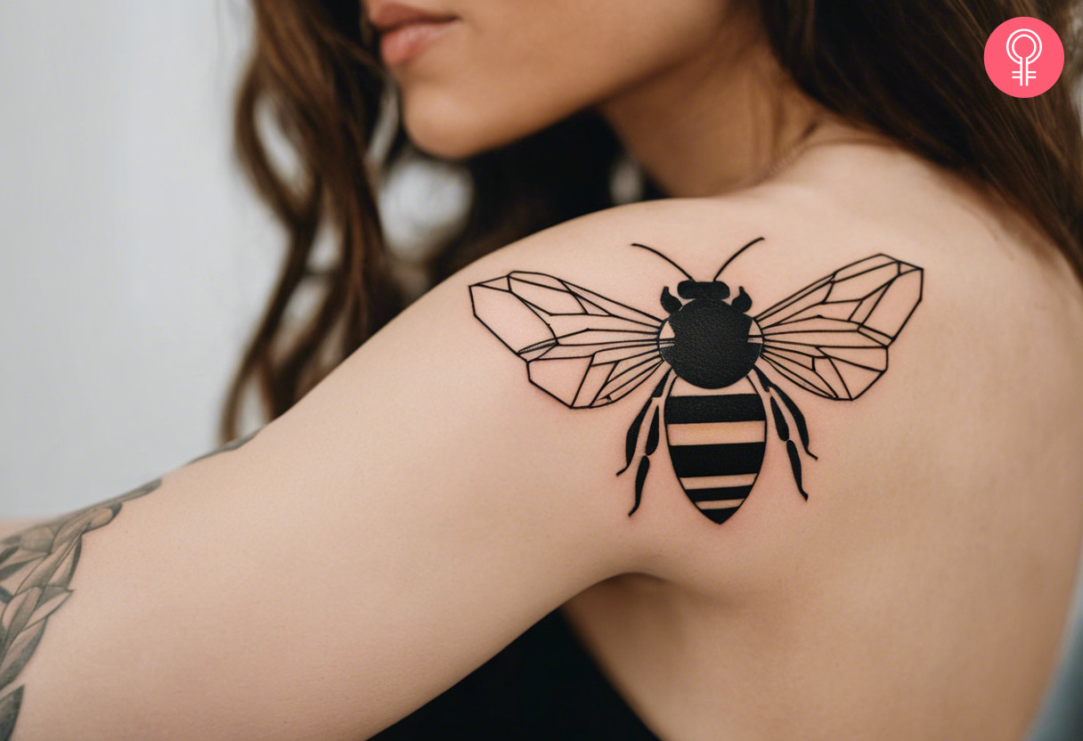 Geometric bee tattoo on the shoulder