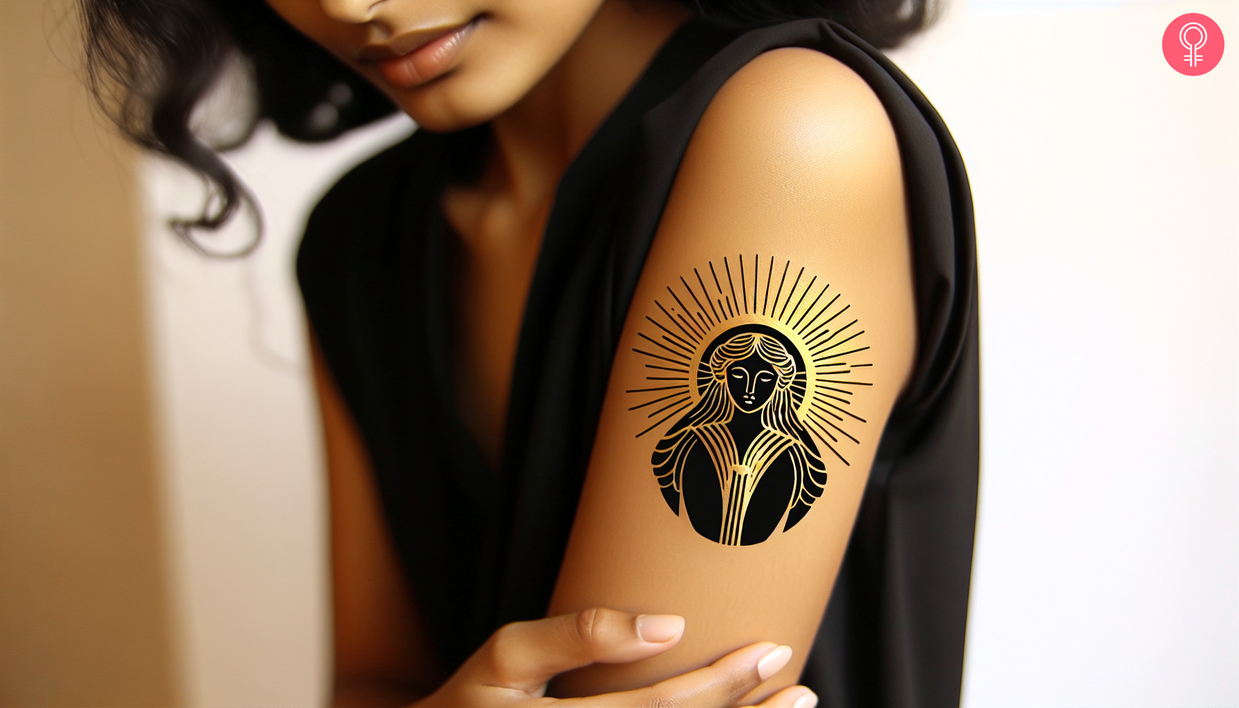 A woman with a golden and black Gaia tattoo on her upper arm